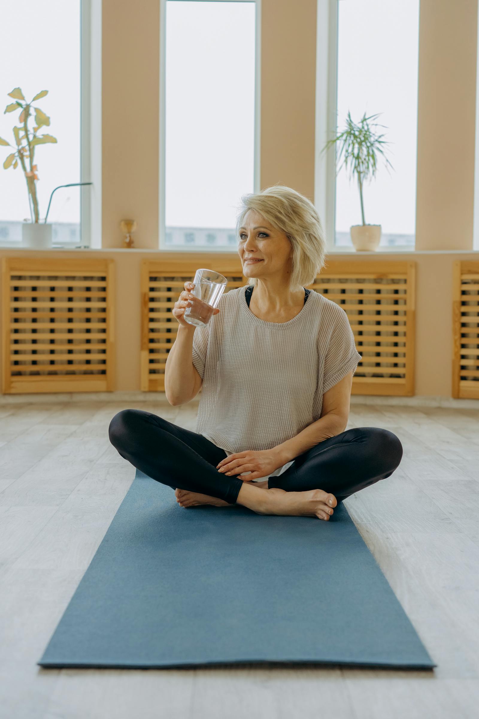 Confident woman in soft morning light — representing the calm, restored feminine vitality good pelvic wellness supports